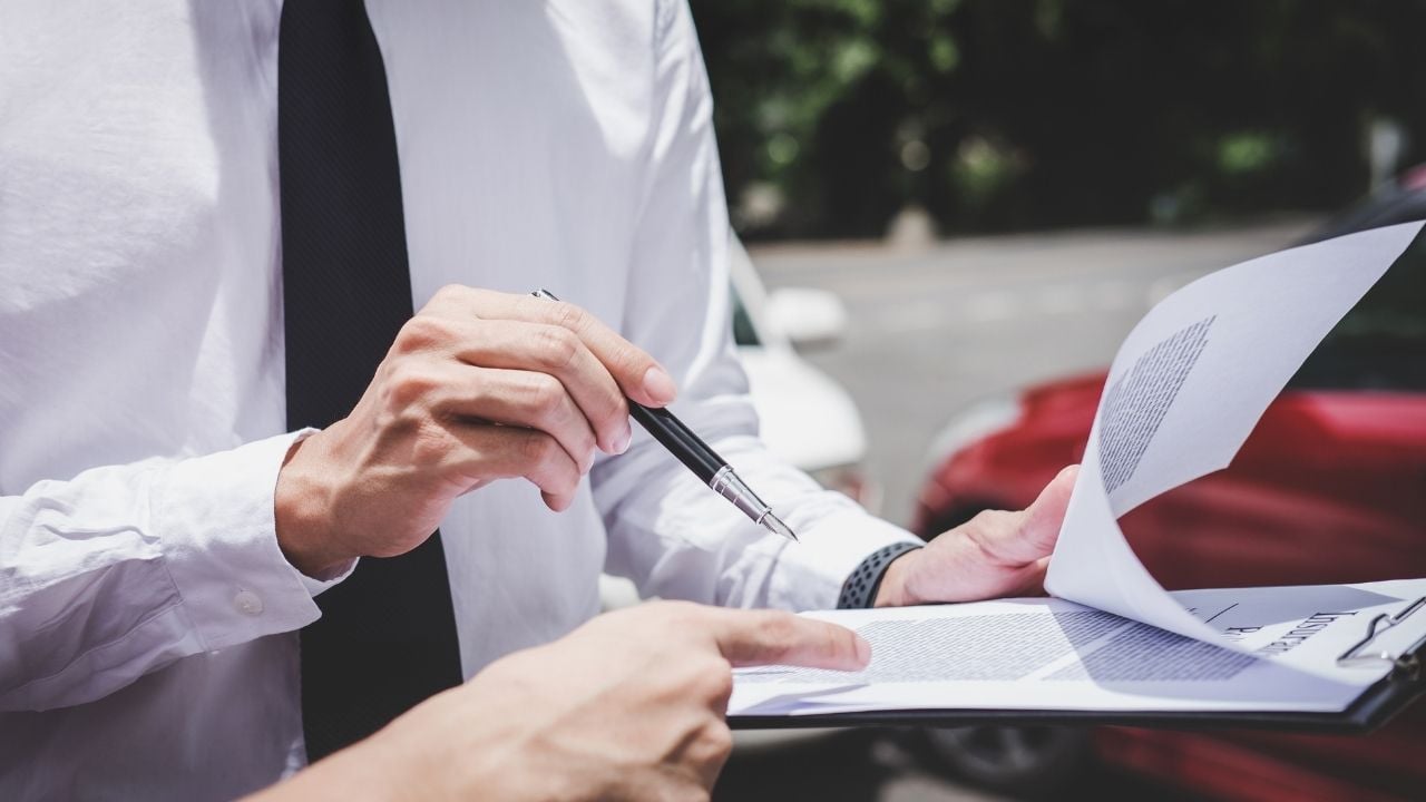 insurance agent working on report form